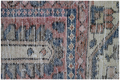 A close-up view of a vintage Persian Bakhtiari rug featuring intricate geometric patterns in wool.
