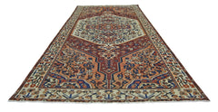 A vintage handmade Persian Bakhtiari rug featuring a traditional floral medallion and geometric motifs.