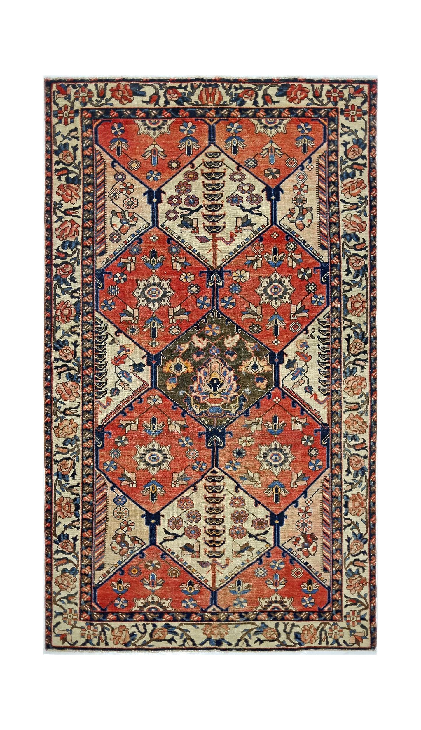 A vintage Persian Bakhtiari rug featuring a geometric diamond pattern in red, blue, and cream.