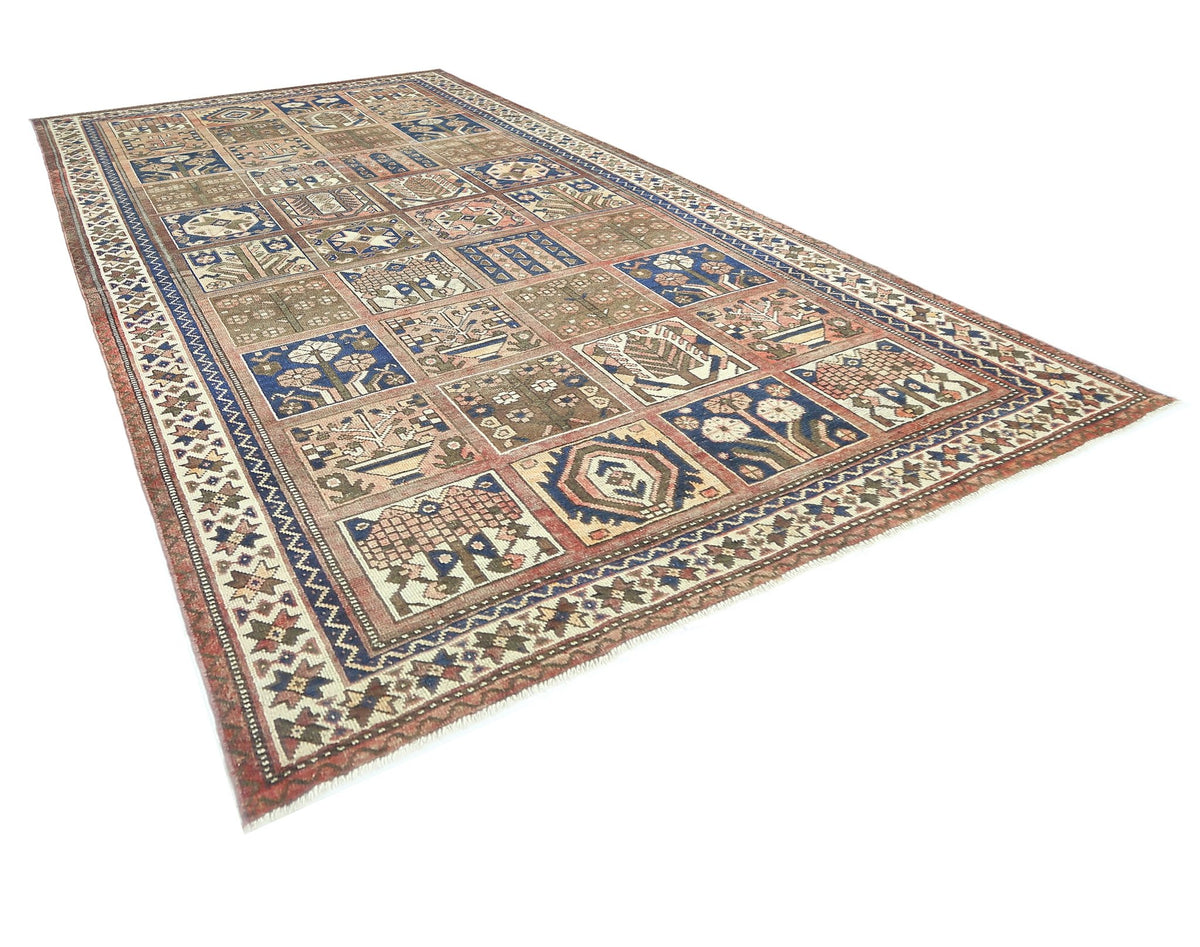 A vintage handmade Persian Bakhtiari rug featuring a multi-colored garden panel design.