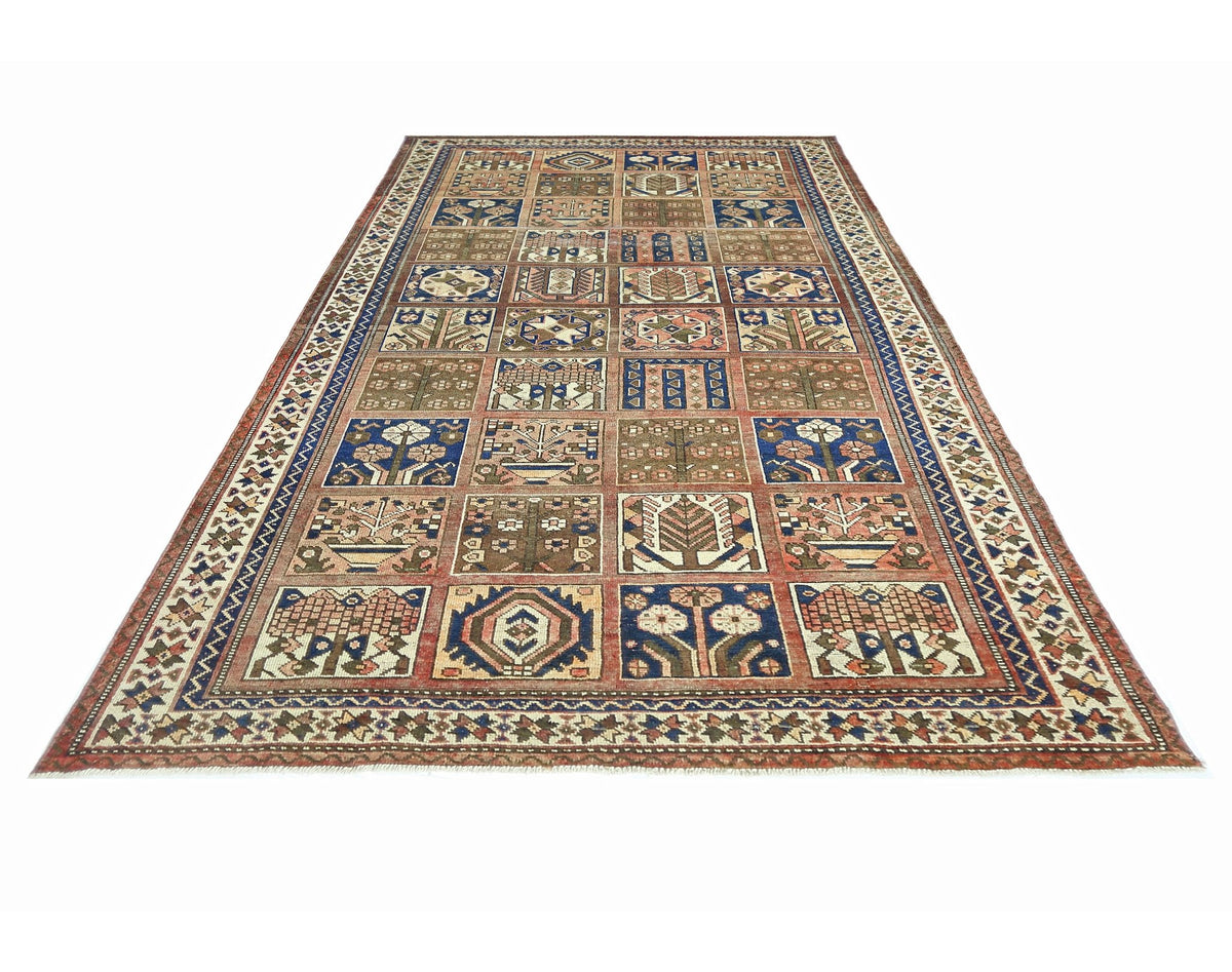 A vintage Persian Bakhtiari rug featuring a multi-colored grid of floral and geometric motifs.