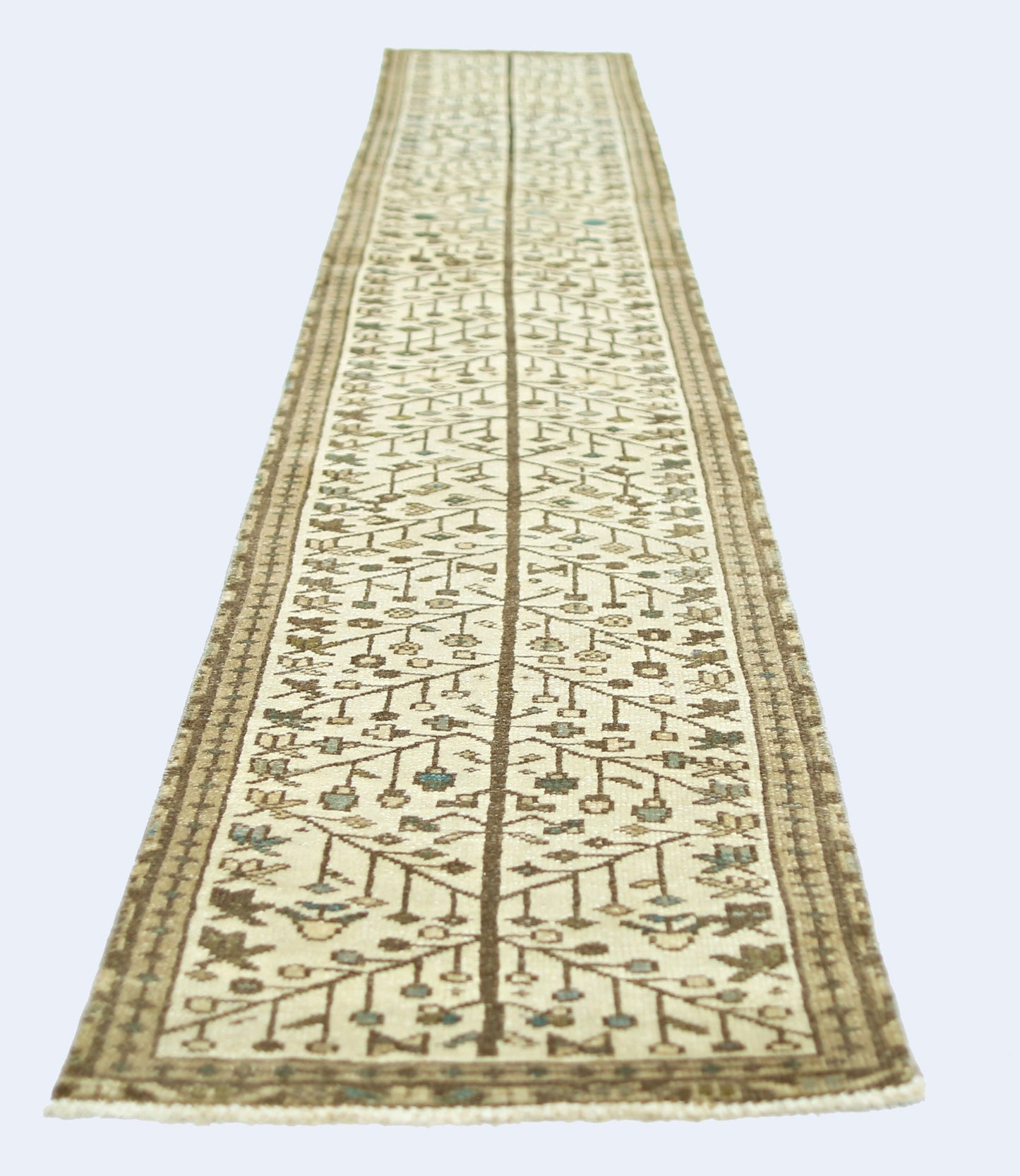 A vintage Persian Bakhtiari runner featuring a central tree motif in neutral tones.
