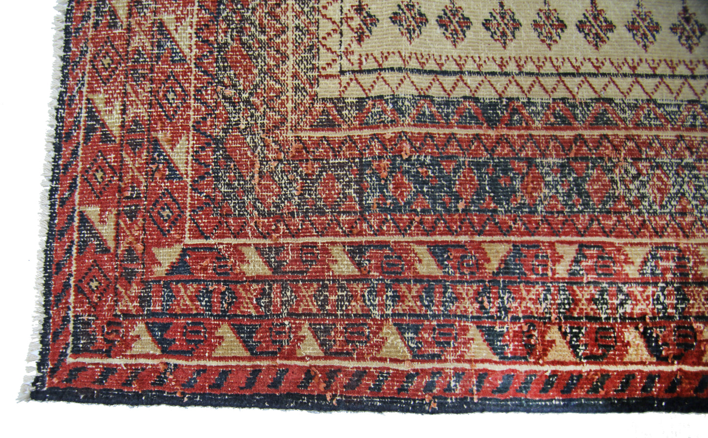 A vintage Persian Bakhtiari runner featuring intricate geometric patterns in red, blue, and cream.