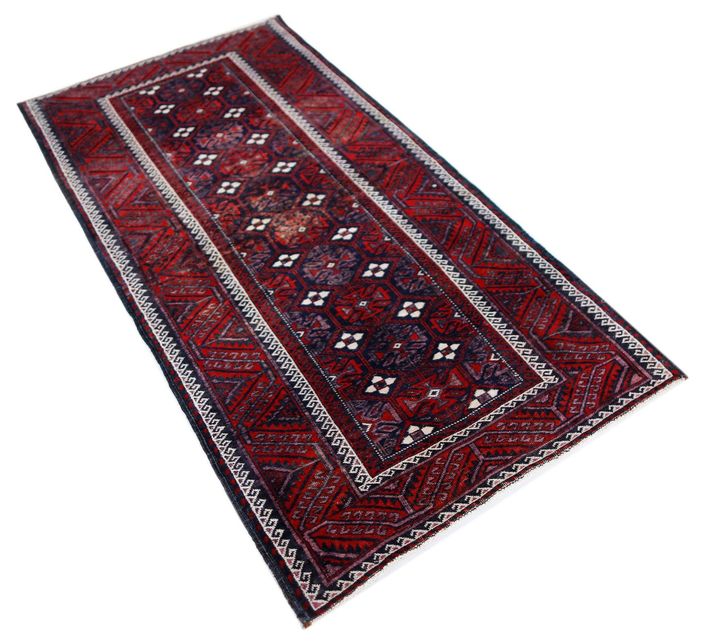 A rectangular vintage Afghan Baluch rug featuring traditional geometric patterns in red and navy.