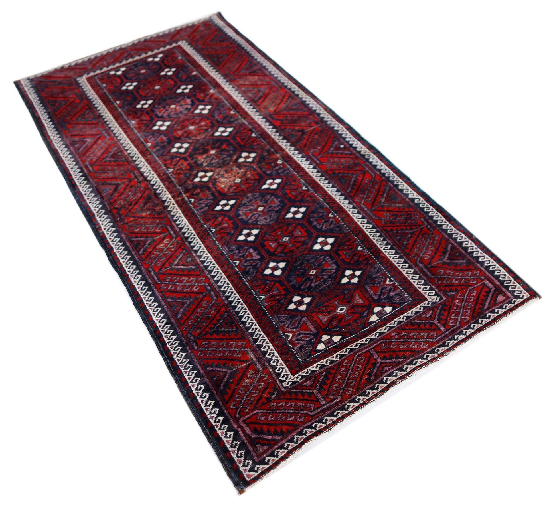 A rectangular vintage Afghan Baluch rug featuring traditional geometric patterns in red and navy.