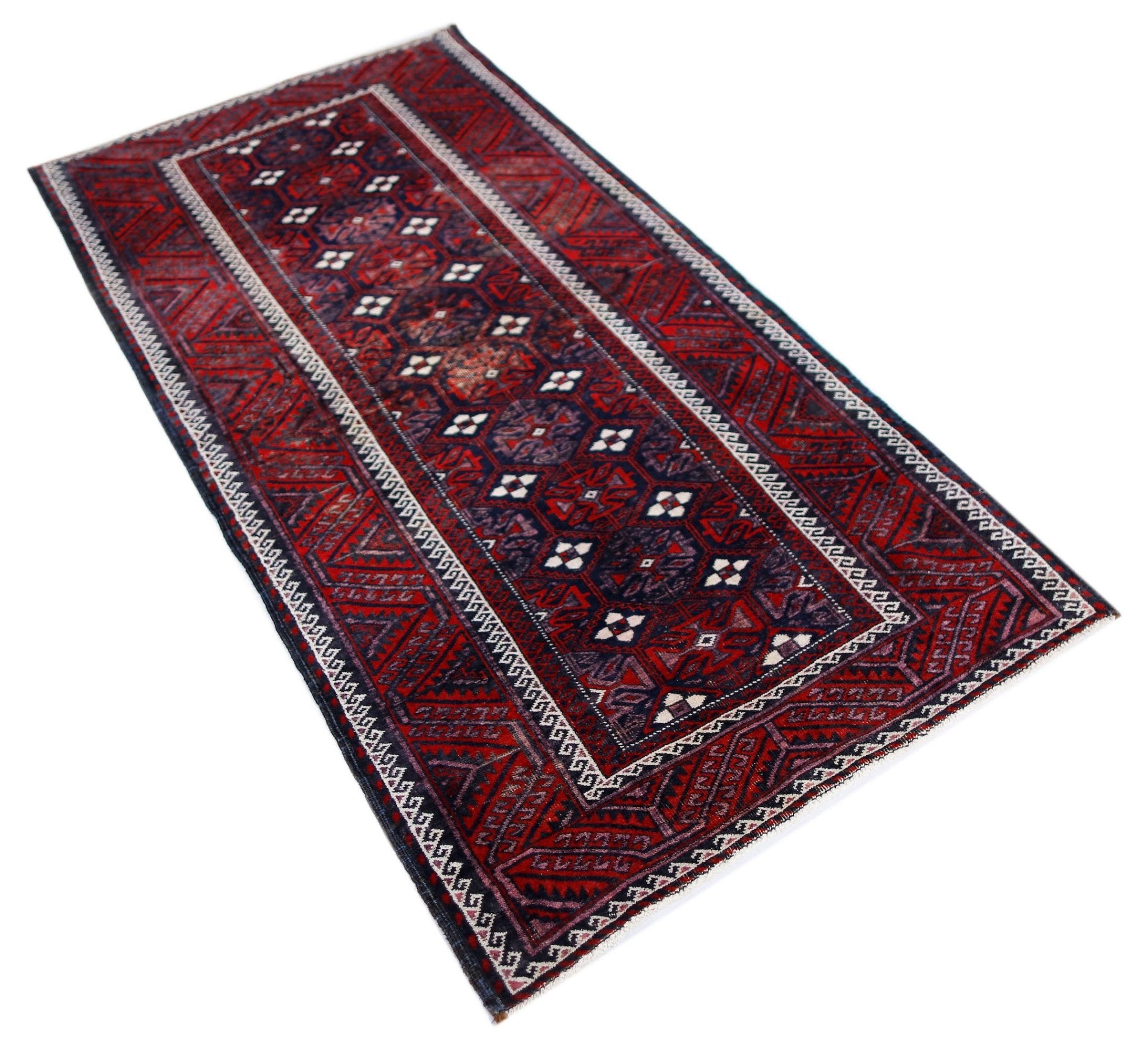 A rectangular vintage Afghan Baluch rug featuring traditional geometric patterns in red and navy.