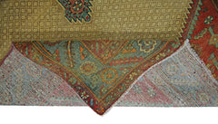 A corner of a vintage Persian Bibikabad rug is folded back to show its wool pile and cotton base.