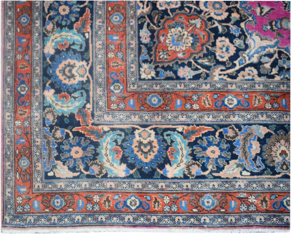 A vintage Persian Bidjar rug featuring a dark blue field with intricate floral and vine patterns.