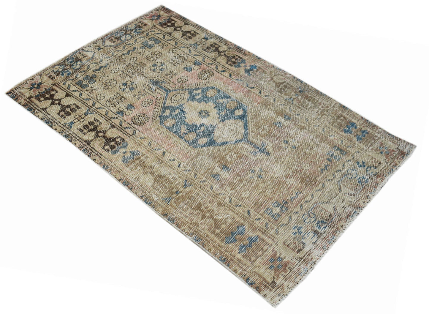 A vintage handwoven Persian Hamadan rug featuring a faded blue and beige geometric medallion design.