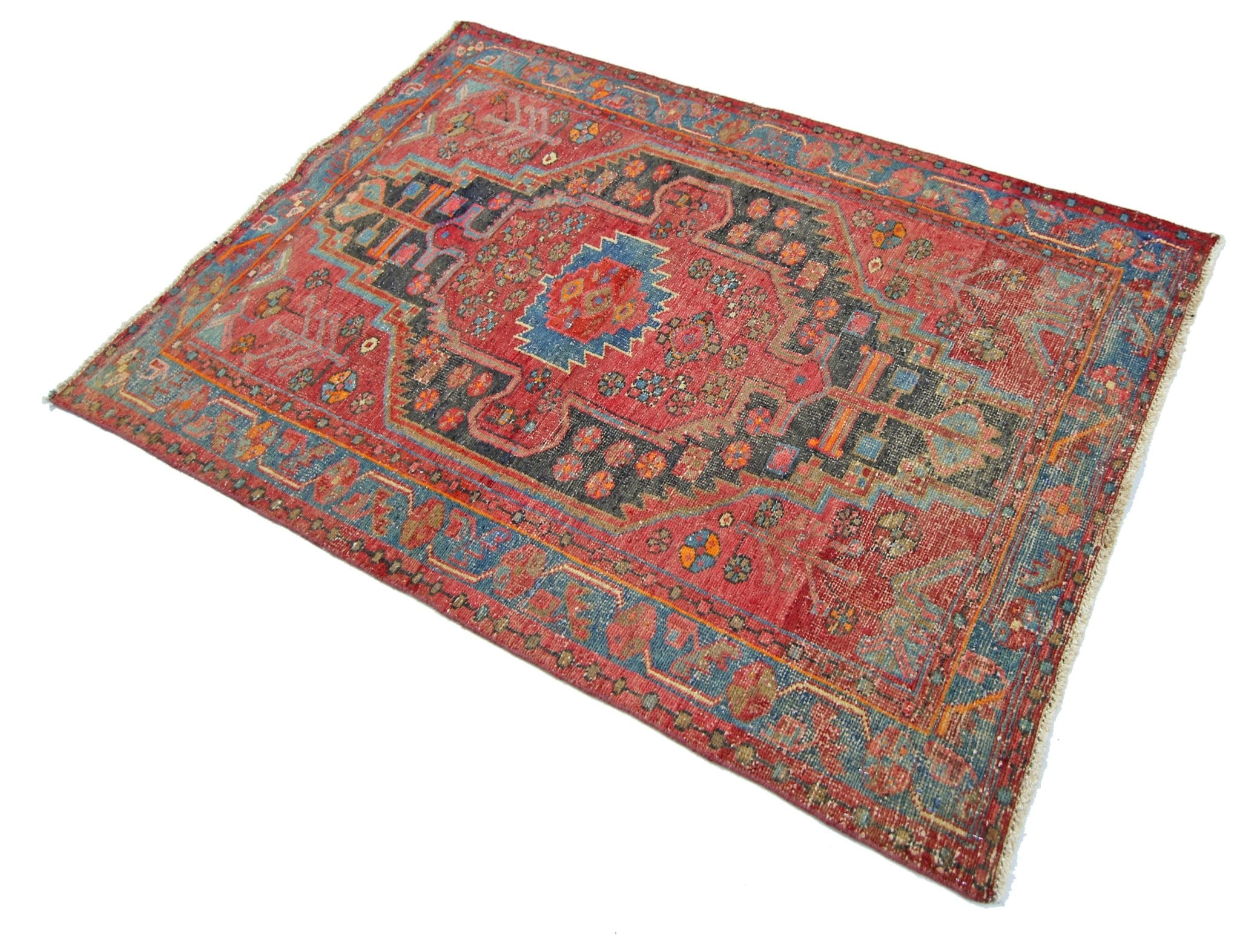 A vintage handmade Persian Hamadan rug featuring a geometric red and blue pattern.