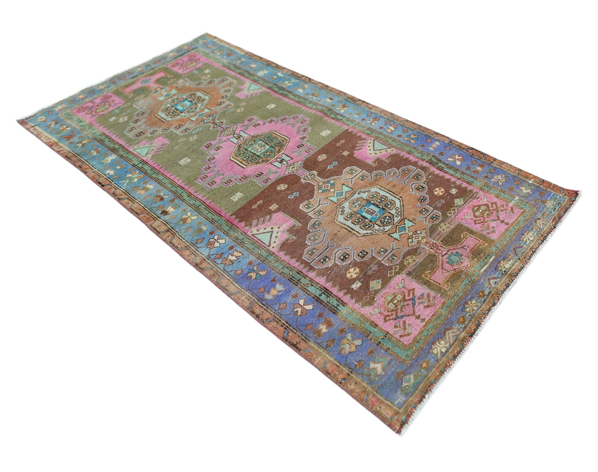 A vintage Persian Hamadan rug featuring a geometric pattern in shades of brown, pink, and blue.