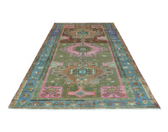 A vintage handmade Persian Hamadan rug featuring a geometric pattern in green, pink, and blue.