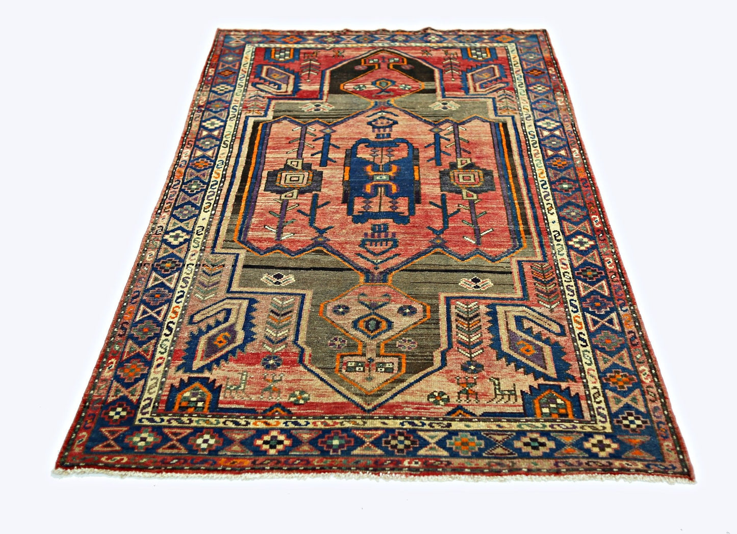 A vintage Persian Hamadan rug featuring a geometric medallion pattern in red, blue, and grey tones.