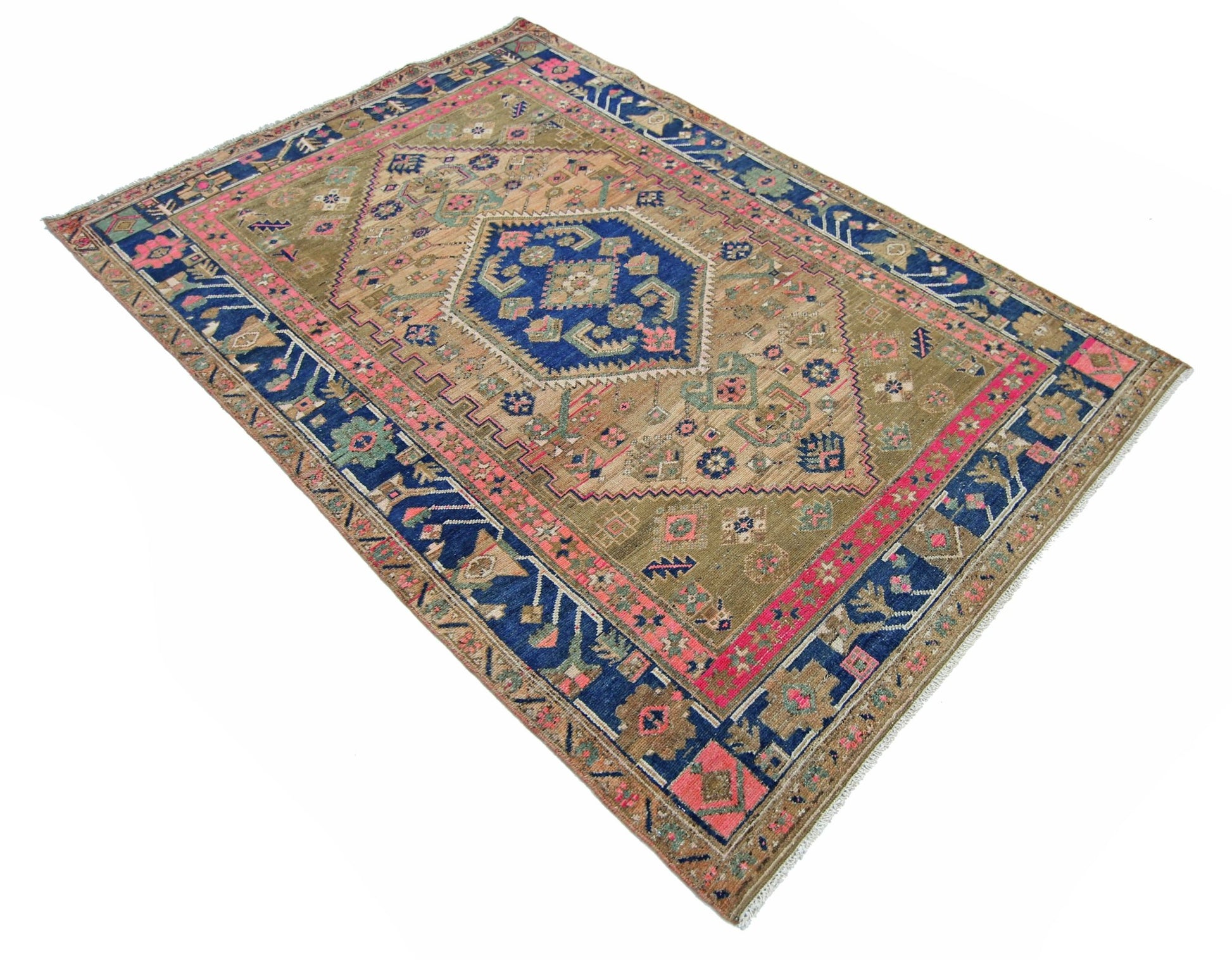 A vintage Persian Hamadan rug featuring a central blue medallion on a tan field with pink accents.