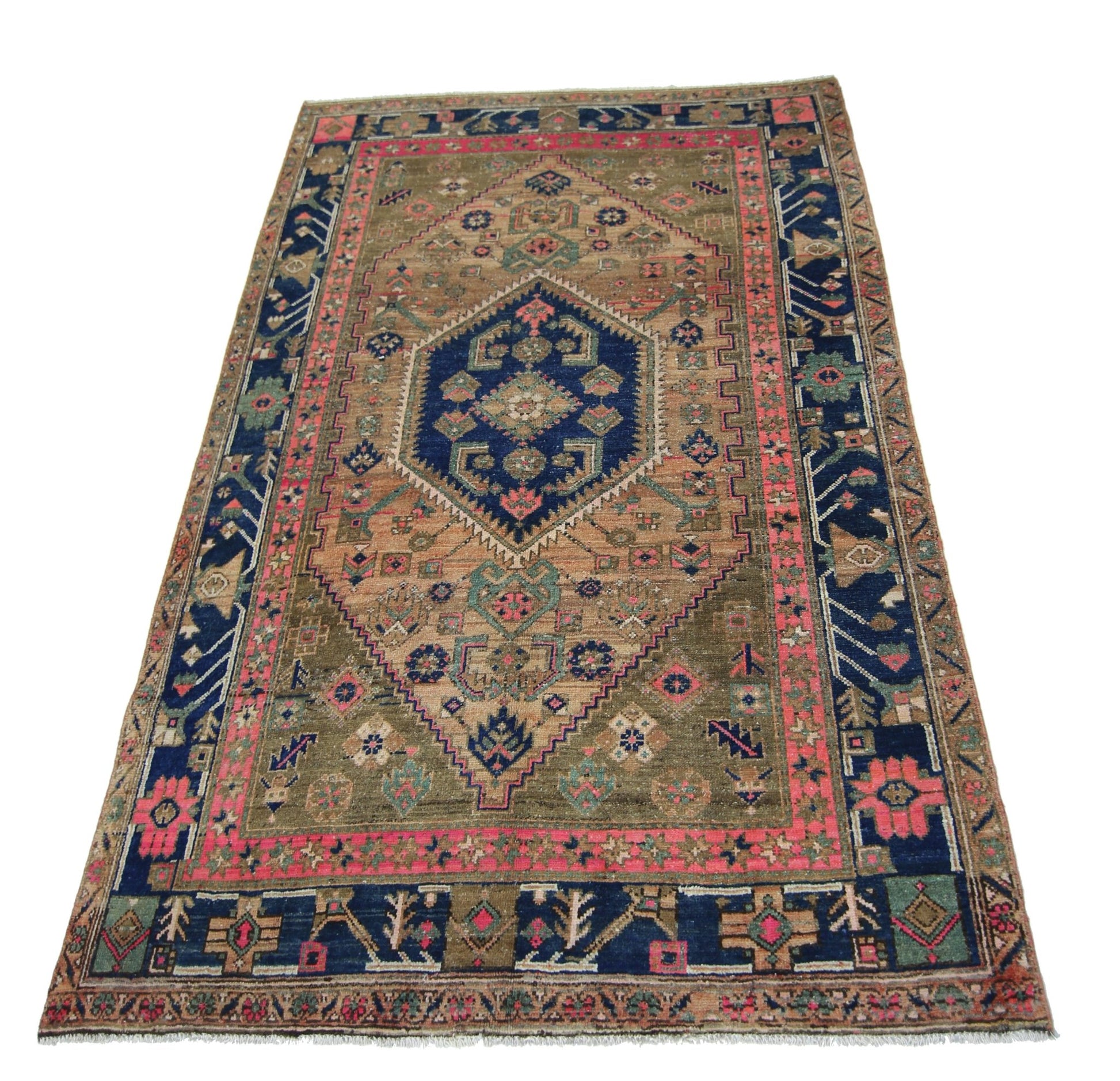 A vintage handmade Persian Hamadan rug featuring a central blue medallion on a tan field.