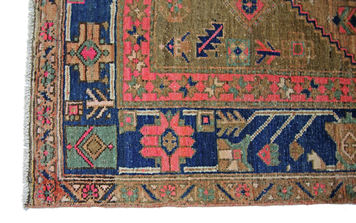 A vintage Persian Hamadan rug featuring geometric patterns in blue, pink, and olive green.
