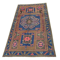 A vintage handmade Persian Hamadan rug featuring a geometric pattern in blue, brown, and pink.