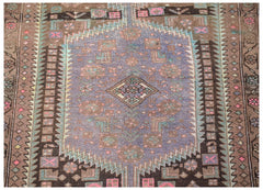 Vintage Persian Hamadan rug featuring a central purple medallion with geometric floral motifs.