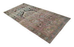 A vintage handwoven Persian Hamadan rug featuring a faded brown field with intricate floral motifs.