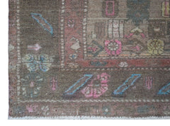 A vintage Persian Hamadan rug featuring a brown field with colorful geometric floral patterns.
