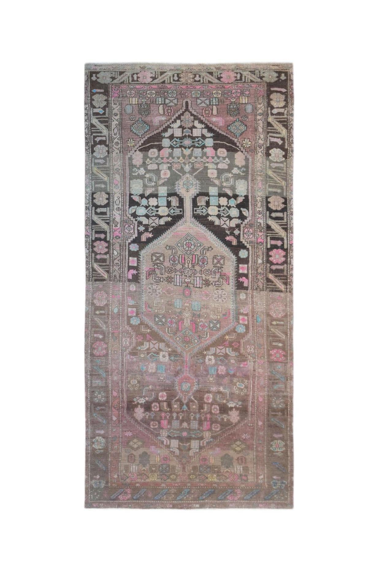 A vintage handwoven Persian Hamadan rug featuring a central medallion in muted pink and brown tones.