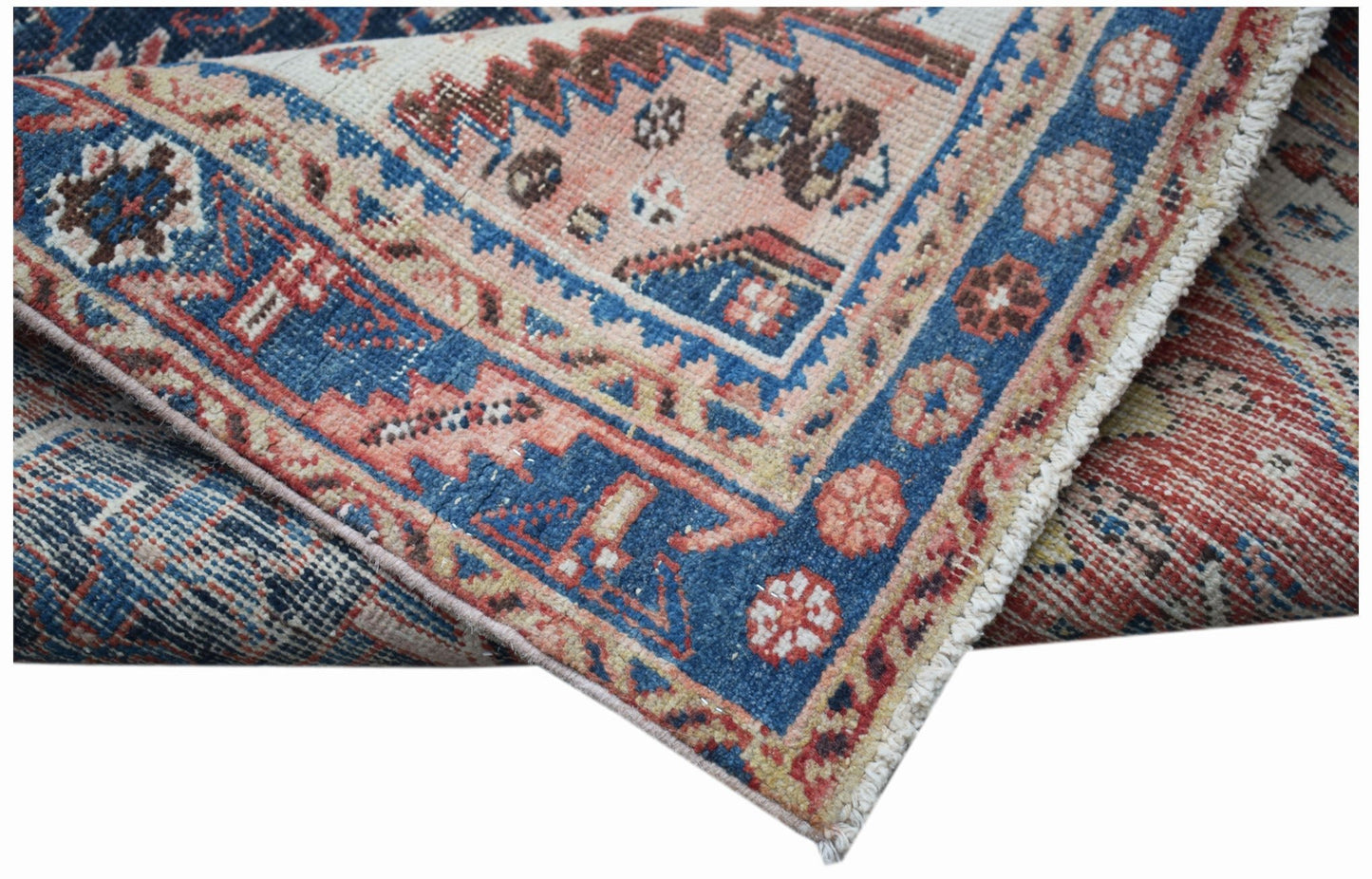 A vintage handwoven Persian Hamadan rug featuring a blue and red geometric floral pattern.