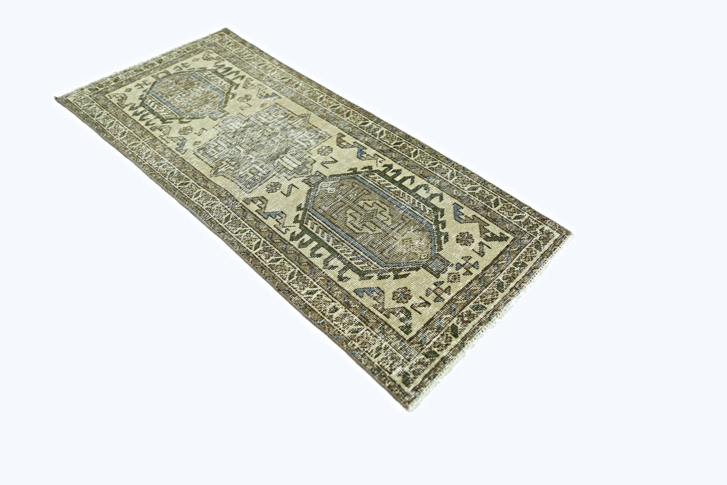 A vintage Persian Hamadan rug featuring a geometric pattern in muted earth tones and blue accents.