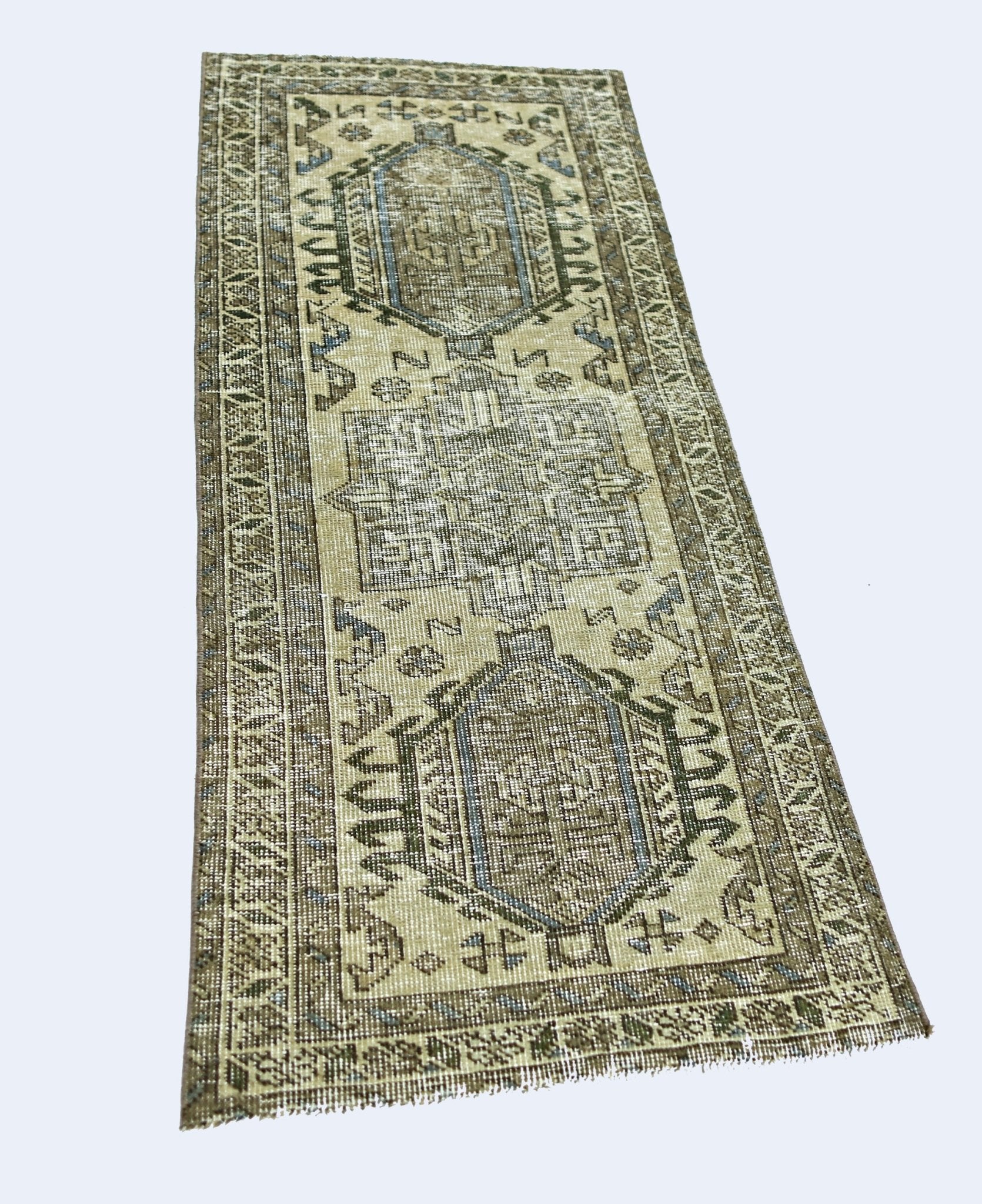 A vintage handmade Persian Hamadan runner rug featuring geometric patterns in muted earth tones.