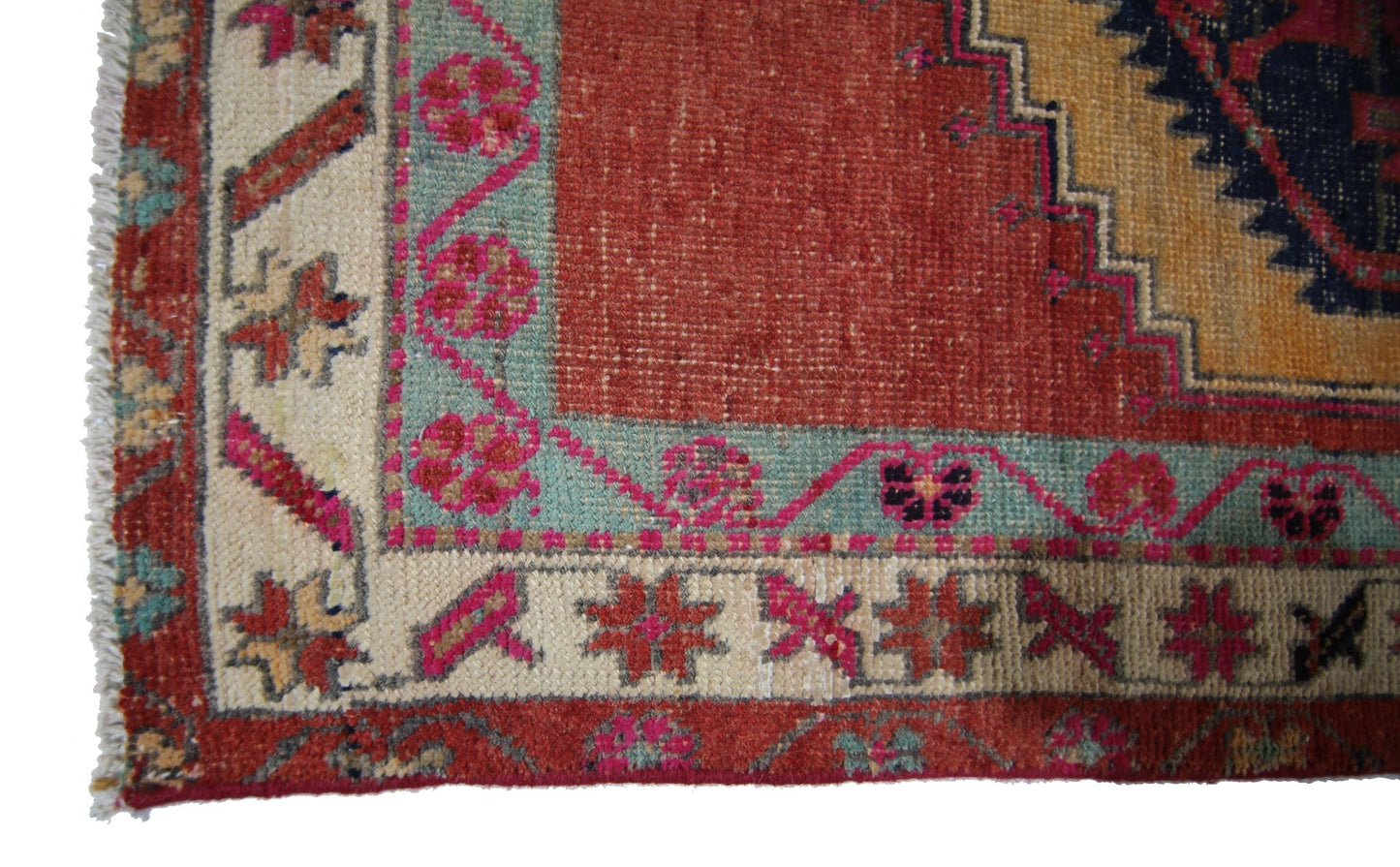 A vintage Persian Hamadan runner featuring a red field with geometric floral patterns and borders.