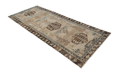 A vintage handwoven Persian Hamadan runner featuring geometric motifs in brown and beige tones.