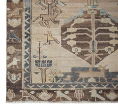 A vintage handwoven Persian Hamadan runner featuring a beige field with brown tree and bird motifs.