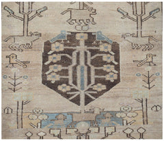 A vintage handwoven Persian Hamadan runner featuring a central tree motif surrounded by animals.