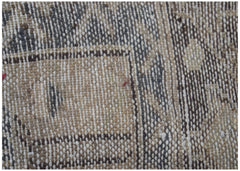 A close-up view of a vintage Persian Hamadan runner featuring intricate woven wool patterns.