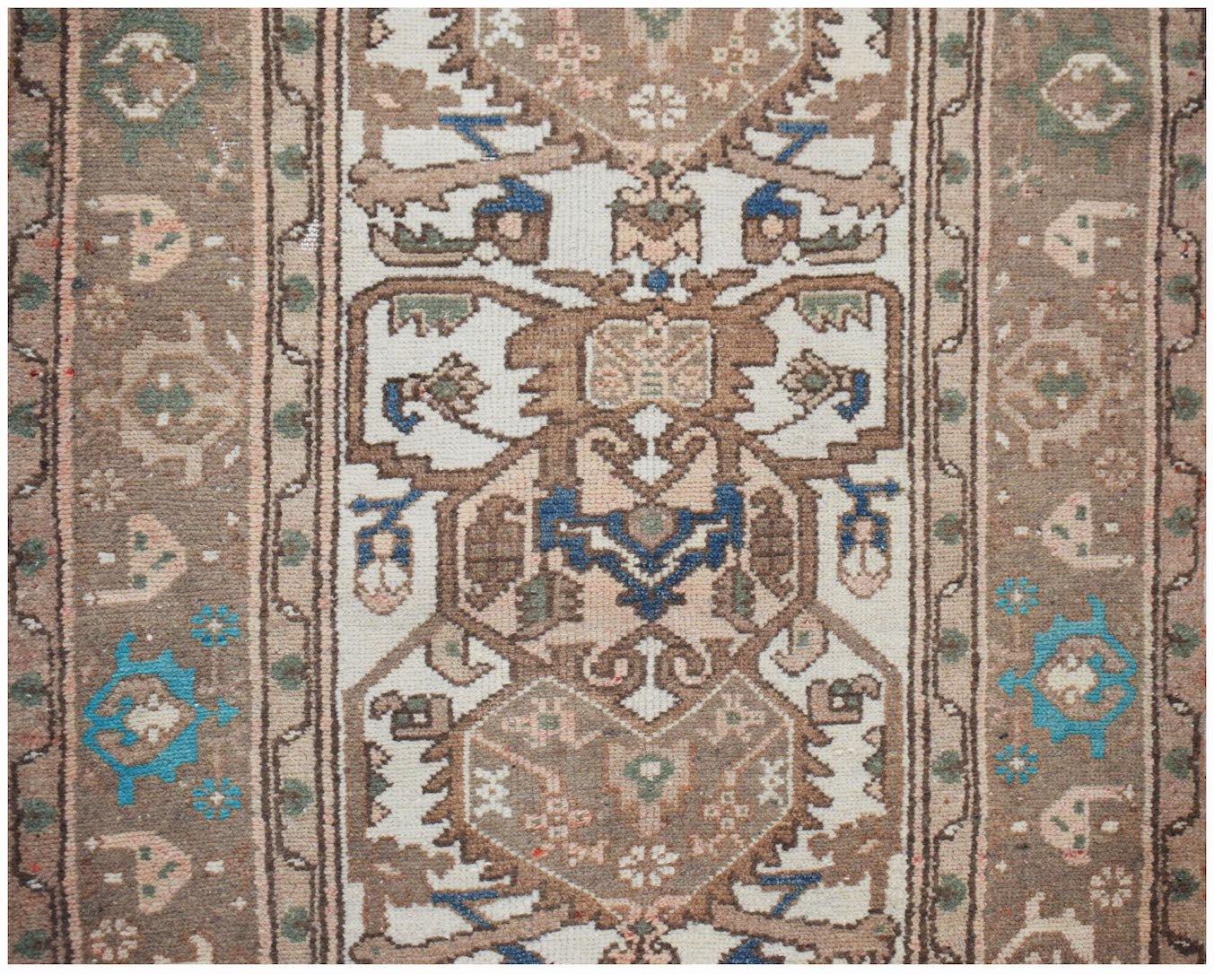 A vintage Persian Hamadan runner featuring intricate geometric patterns in brown, blue, and cream.