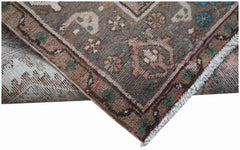 A vintage handwoven Persian Hamadan runner featuring a traditional floral pattern in wool.