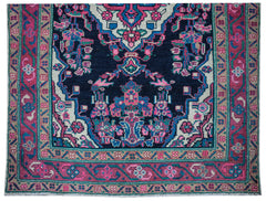 A vintage Persian Hamadan runner featuring a dark blue field with vibrant pink and teal patterns.