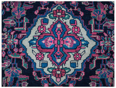 A vintage Persian Hamadan runner featuring a central floral medallion in pink, blue, and cream.