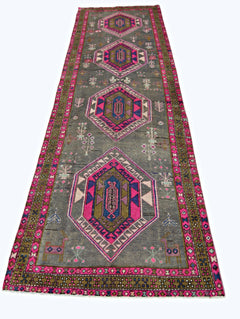 A vintage Persian Hamadan runner featuring four pink and blue geometric medallions on a grey field.