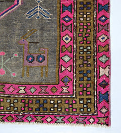 A vintage Persian Hamadan runner featuring a grey field with a stylized animal and pink borders.