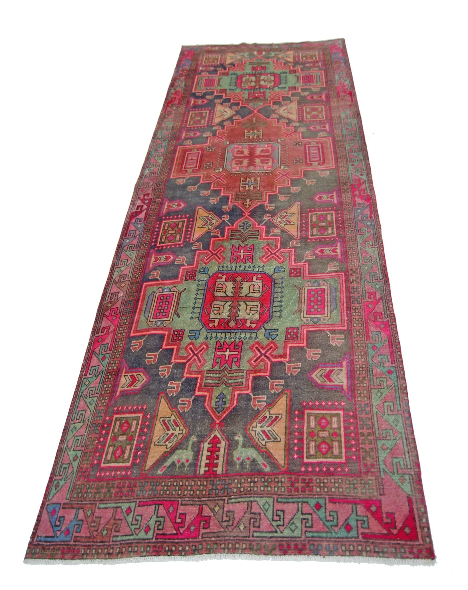 A vintage Persian Hamadan runner featuring geometric patterns in vibrant pink, green, and blue.
