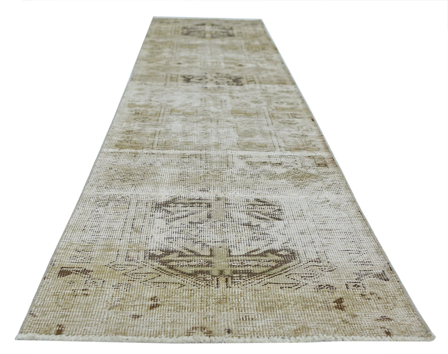 A vintage Persian Hamadan runner rug featuring a faded geometric pattern in neutral beige tones.