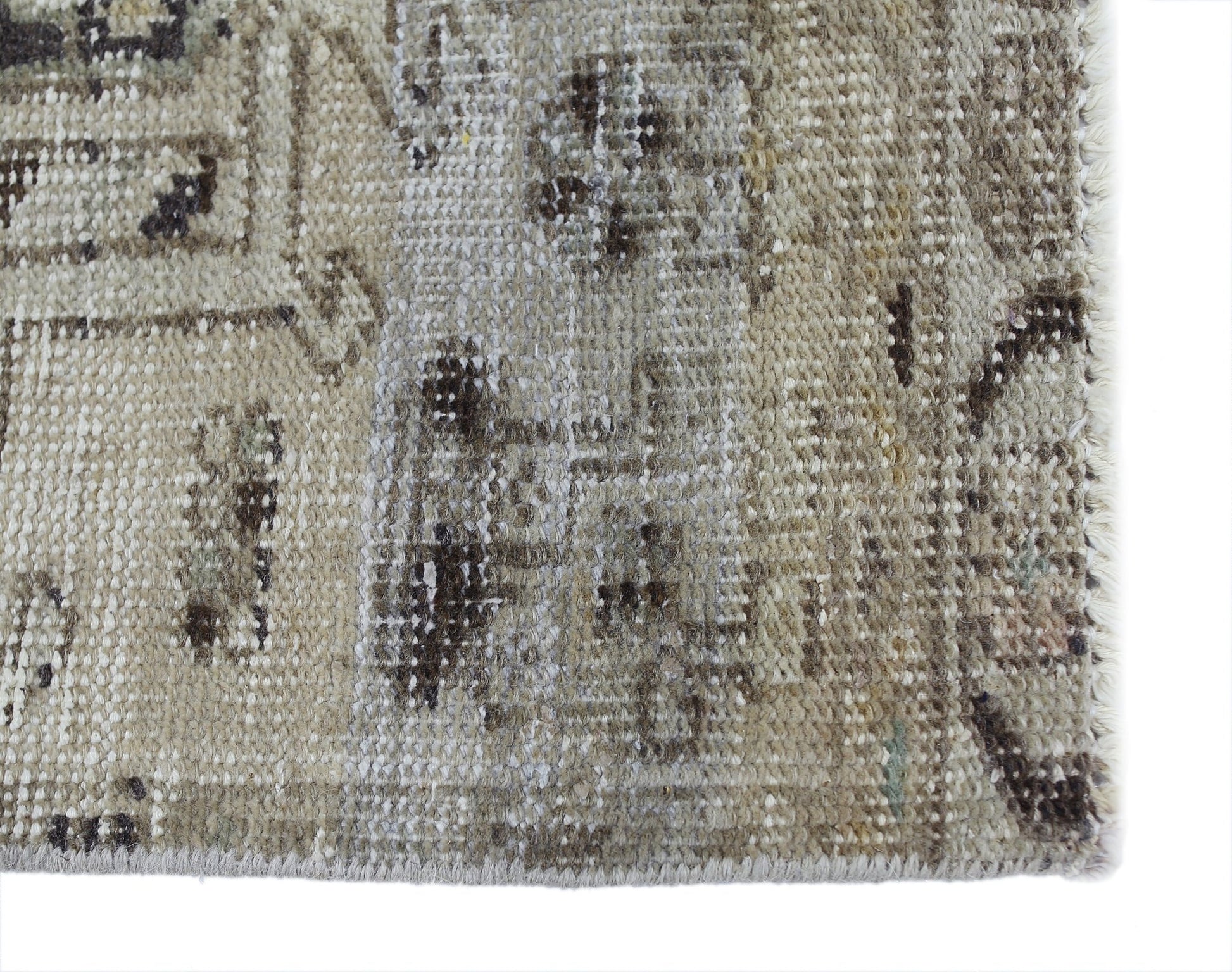 A close-up of a vintage Persian Hamadan runner featuring a faded, distressed wool pattern.