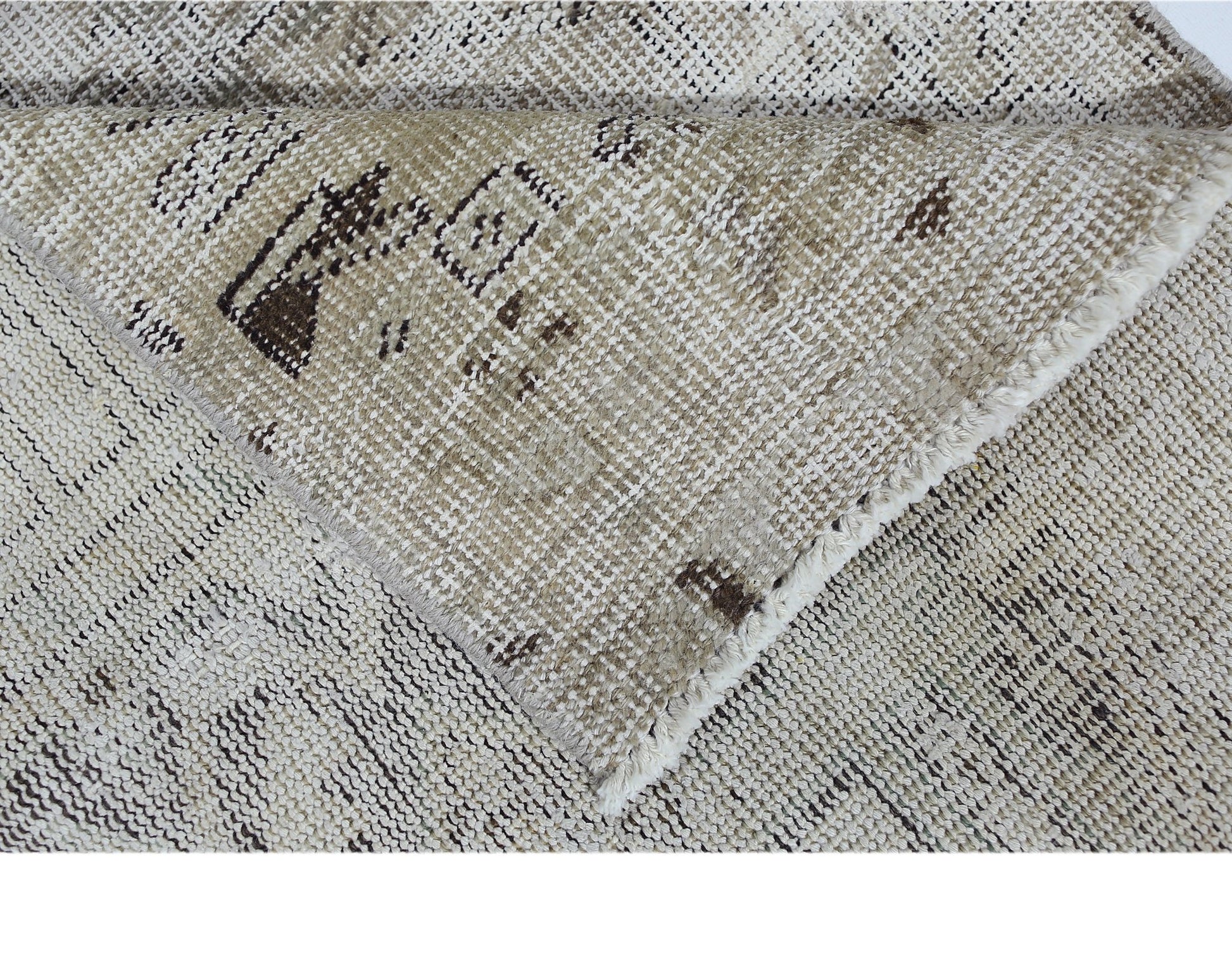 A vintage Persian Hamadan runner with a distressed beige and brown geometric pattern.