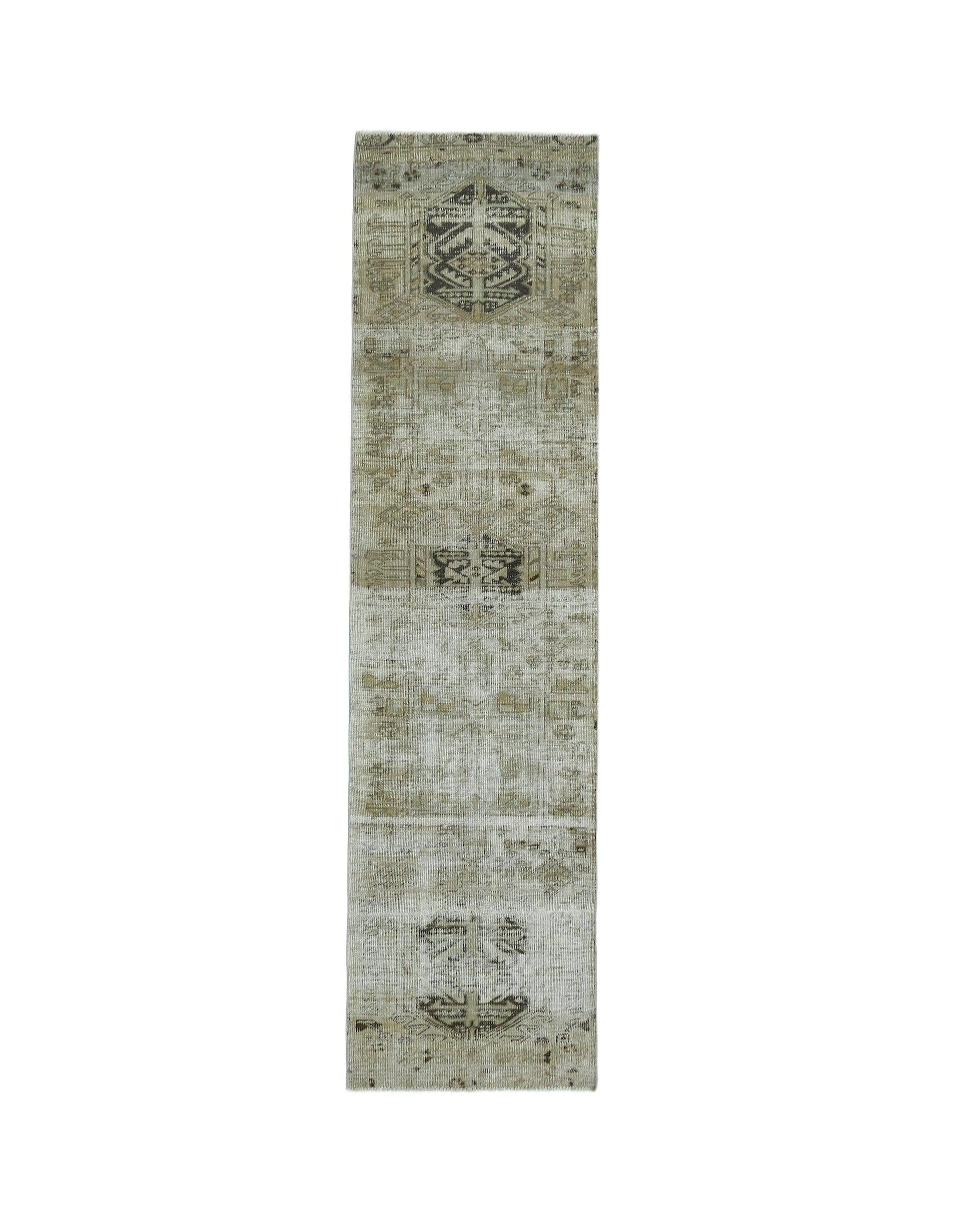 A vintage Persian Hamadan runner featuring faded geometric patterns in neutral beige and grey tones.