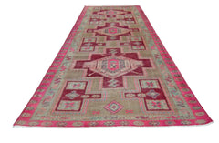 A vintage Persian Hamadan runner featuring geometric patterns in shades of pink and beige.