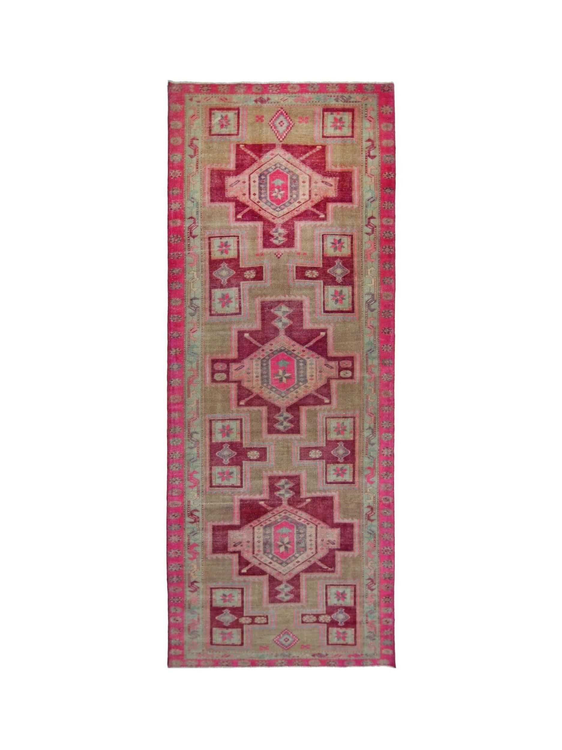 Vintage Persian Hamadan runner featuring geometric medallions in shades of pink and tan.