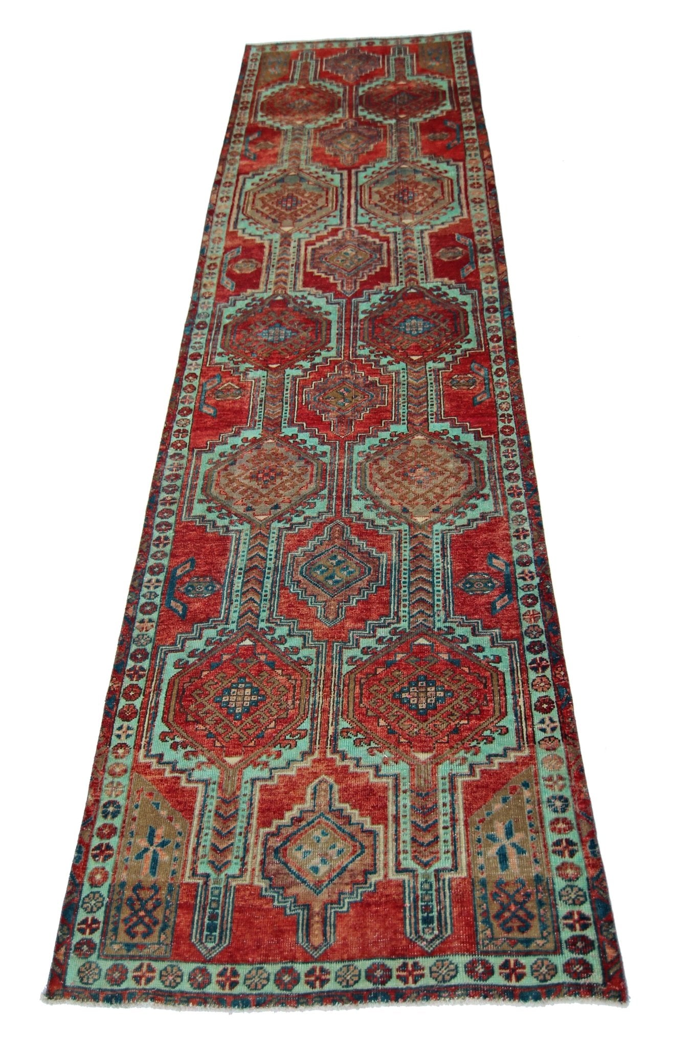 A vintage Persian Hamadan runner featuring geometric medallions in red and teal wool.