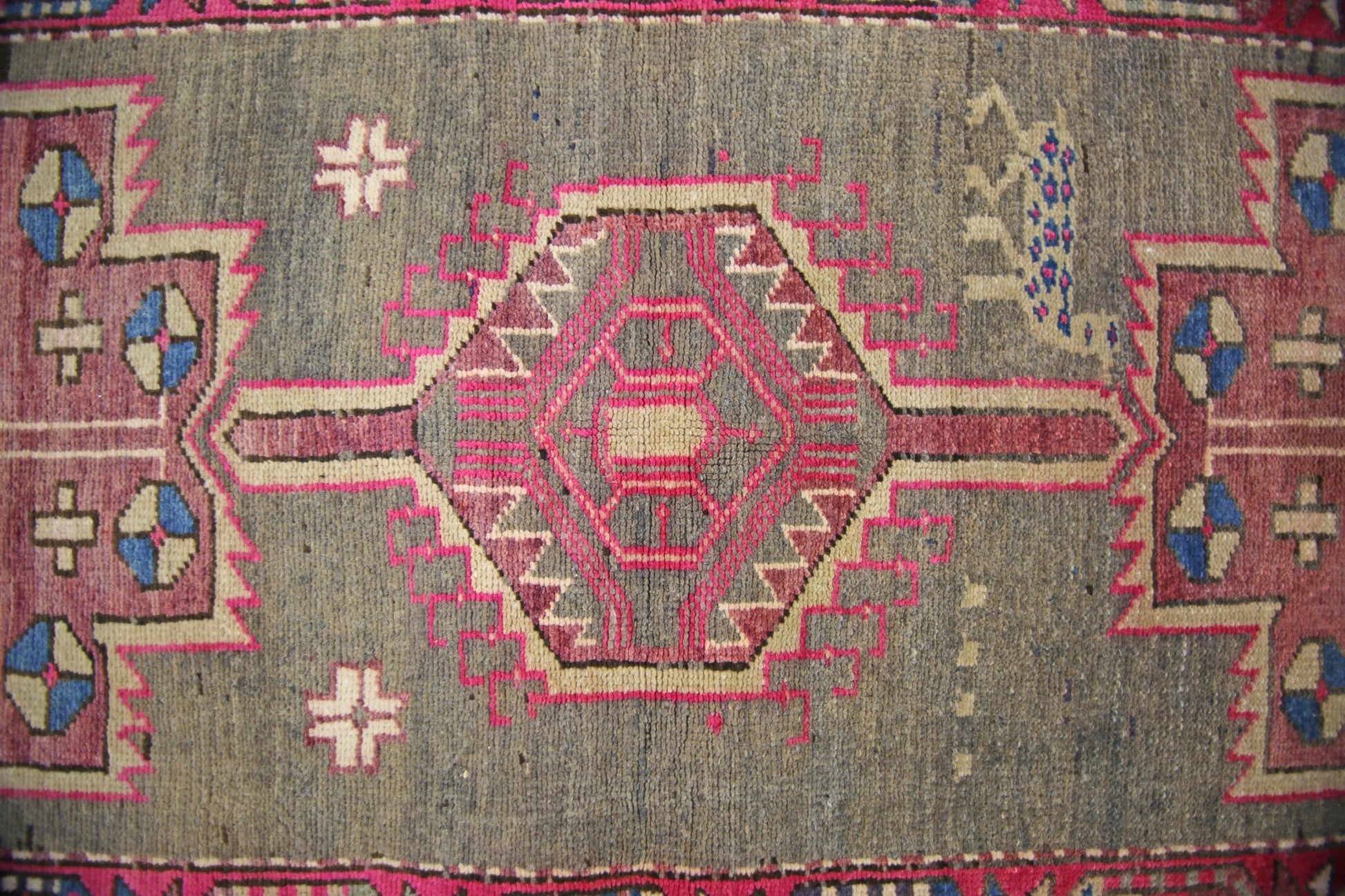 A vintage Persian Hamadan runner featuring a central geometric medallion on a grey wool field.