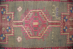 A vintage Persian Hamadan runner featuring a central geometric medallion on a grey wool field.