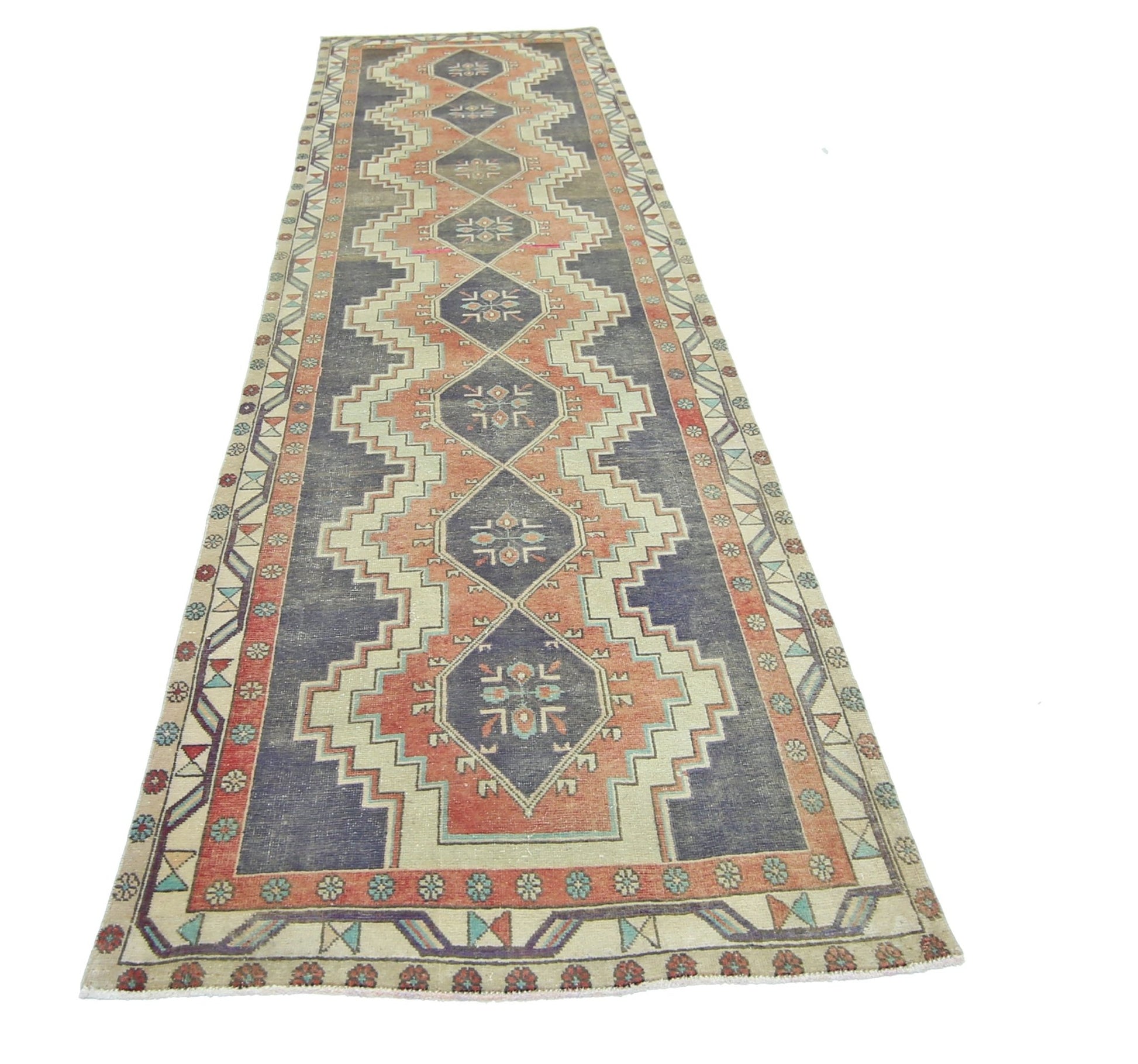 A vintage Persian Hamadan runner rug featuring a geometric diamond pattern in blue and coral tones.